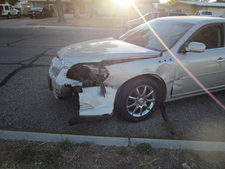 Man arrested after crashing into ambulance