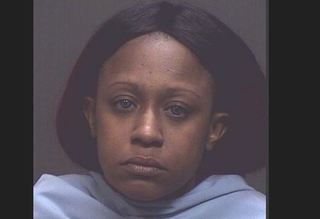 Police arrest woman after motorcycle wreck