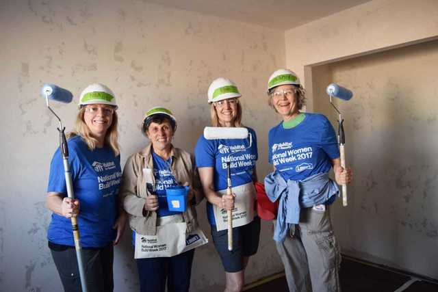 Women show off their strength to help build home for local family Women show off their strength to help build home for local family
